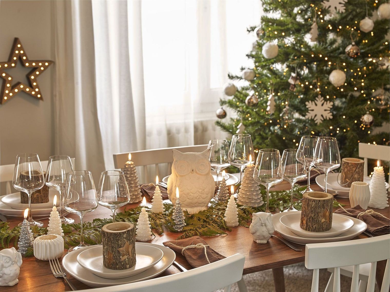 Festive Centerpiece with Candles and Greenery Christmas decoration on dining table