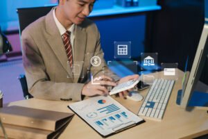 Male businessman working desk office-with-using-calculator-calculate-numbers-business-report-talk-smart-phone-office-desk-finance-accounting