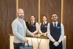 hotel staff, mature male traveler standing