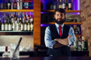 Positive barkeeper standing counter
