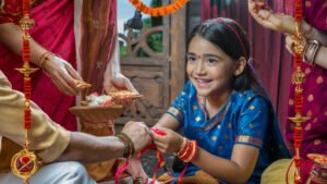 cute indian brother sister celebrating raksha bandhan