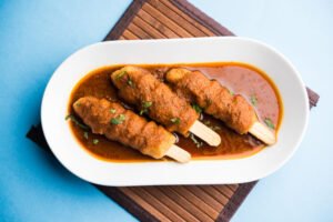 Soya chaap curry served in a bowl