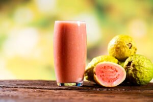 Fruits and red guava juice in a glass