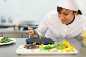 Pretty professional chef cooking in a kitchen.