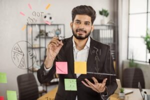 Indian man drawing diagram