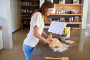 Baker making dough for bread