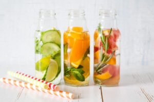 Selection of infused water in glass bottles