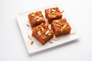 Gajar halwa barfi or carrot pudding barfee is a popular indian sweet dish