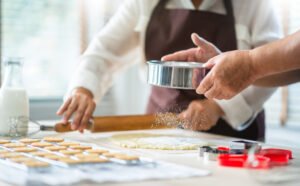 midsection senior couple preparing food kitchen
