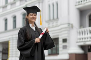 Girl standing with degree outside college
