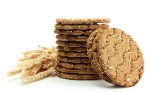 Tasty crispbread and ears isolated on white