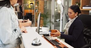 woman passport help desk hotel with check id booking info suite vacation