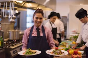 young waitress presenting dishes